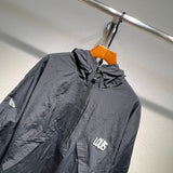 Close-up detail shot of Louis Vuitton luxury clothing with label-forward styling