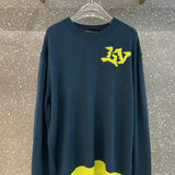 Side profile of Louis Vuitton luxury clothing with label-forward styling