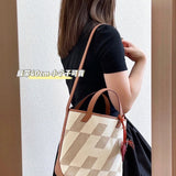 Side view of tailored structured handbag