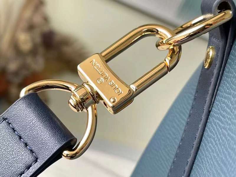 Handle and strap detail of modern sleek women's handbag – women's luxury accessory
