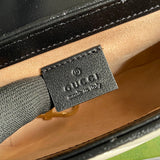 Side profile of chic polished women's handbag – women's statement bag