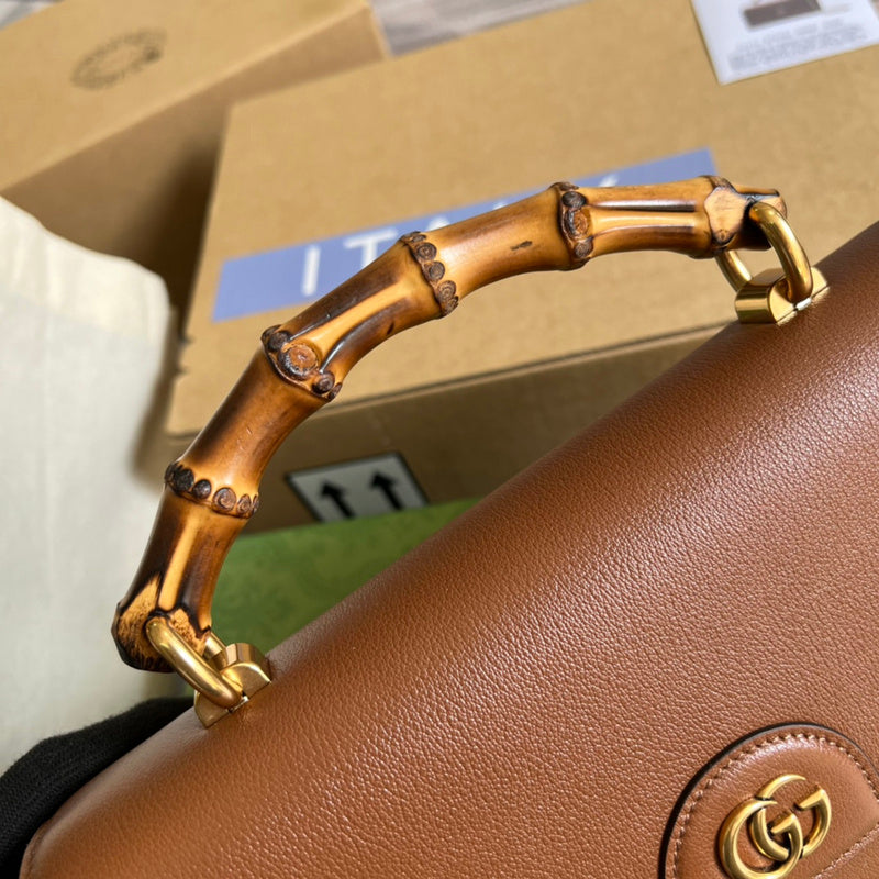 Handle and strap detail of everyday-luxe structured women's handbag – women's luxury accessory