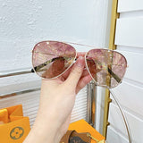 Angled view of Louis Vuitton unisex sunglasses