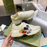 Gucci Designer sneakers in muted earth tones heritage-inspired look front view