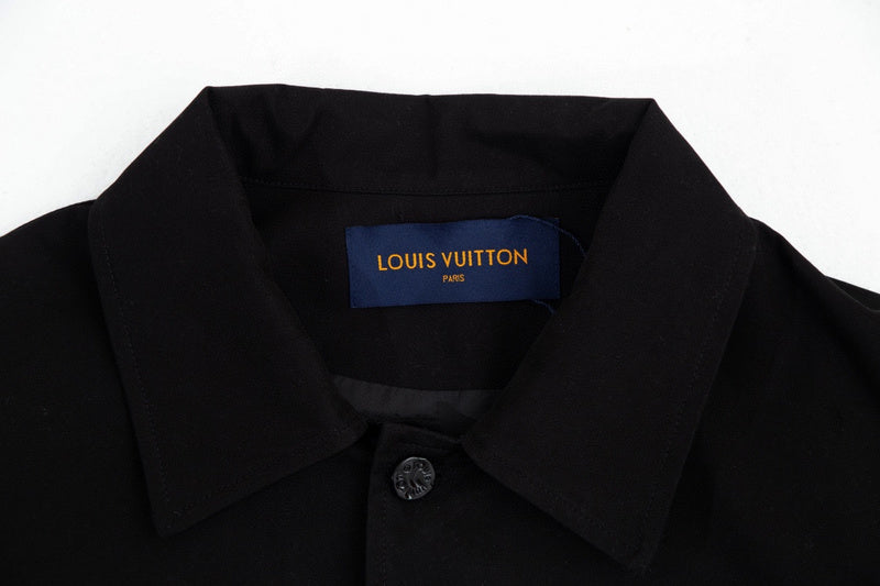 Close-up detail shot of Louis Vuitton luxury clothing with monogram-inspired silhouette