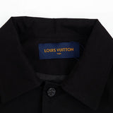 Close-up detail shot of Louis Vuitton luxury clothing with monogram-inspired silhouette