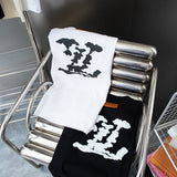 Close-up detail shot of Louis Vuitton cotton t-shirt with monogram-inspired silhouette