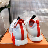 Hermès White High-Top Sneakers - Close-Up Texture View