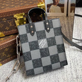 Front view of polished modern women's handbag – women's designer-style accessory