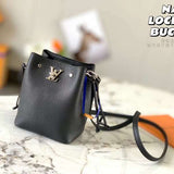 Side profile of everyday-luxe signature women's handbag – women's luxury accessory