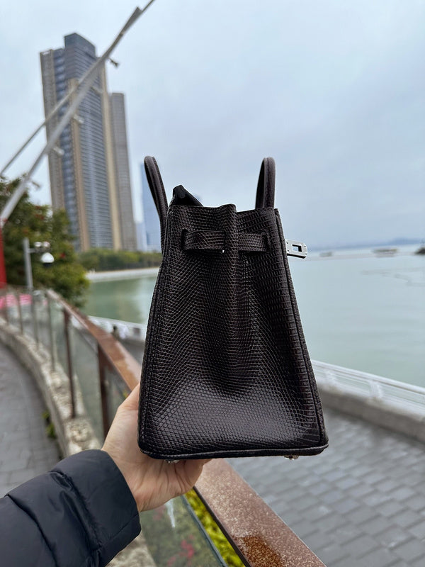 Side view of tailored structured handbag