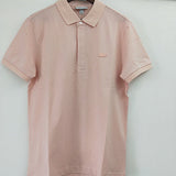 Flat lay presentation of Lacoste luxury clothing with signature branding