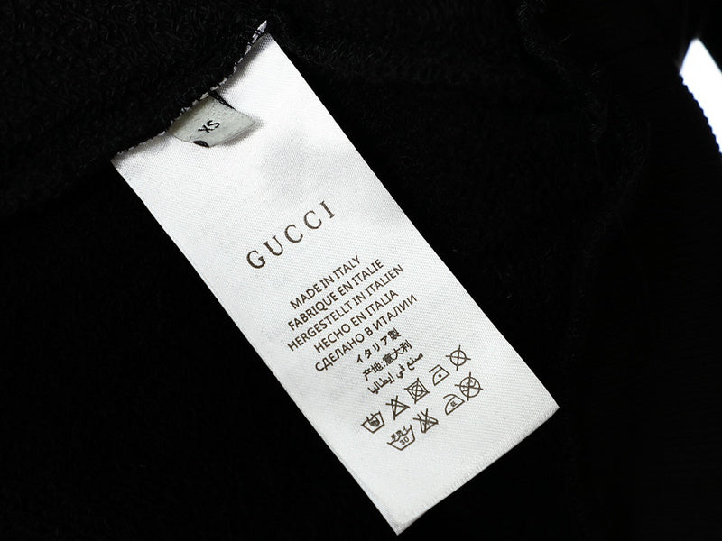 Close-up detail shot of Gucci luxury clothing with tailored silhouette