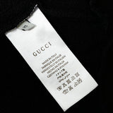 Close-up detail shot of Gucci luxury clothing with tailored silhouette