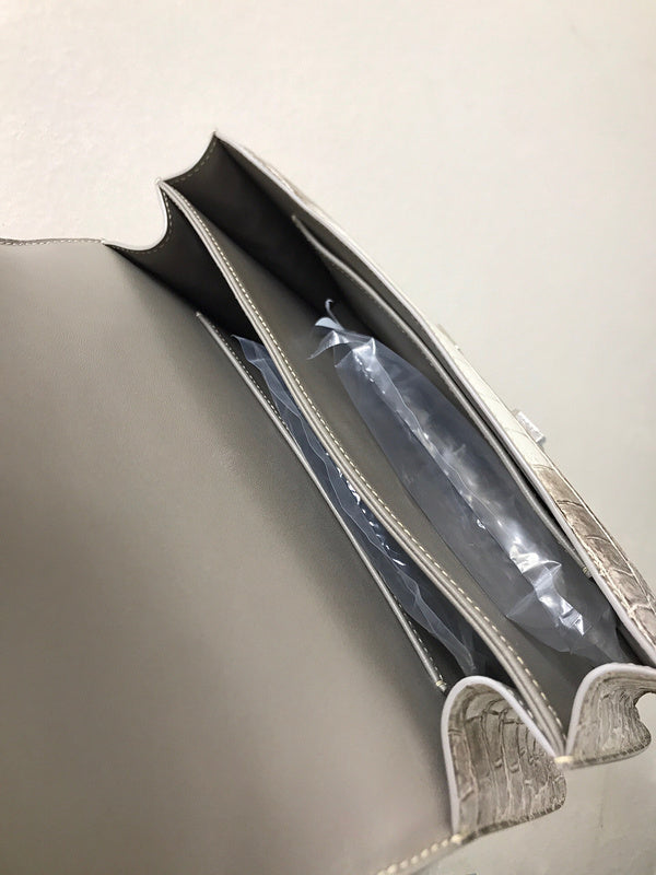 Side view of sculpted structured handbag