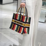 Handle and strap detail of modern statement women's handbag – women's luxury accessory
