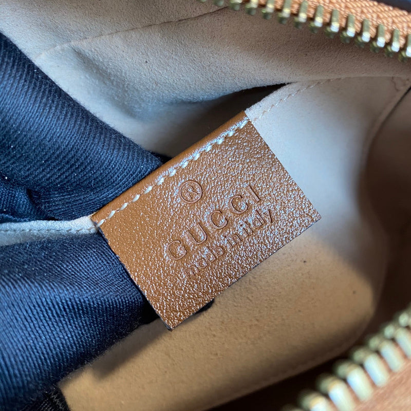 Side profile of signature sleek women's handbag – women's designer-style accessory