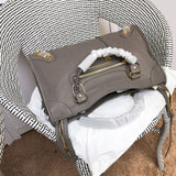 Styled lifestyle shot of structured statement women's handbag – women's designer-style accessory