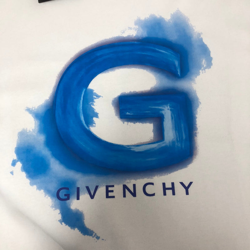 Flat lay presentation of Givenchy luxury clothing with tailored silhouette