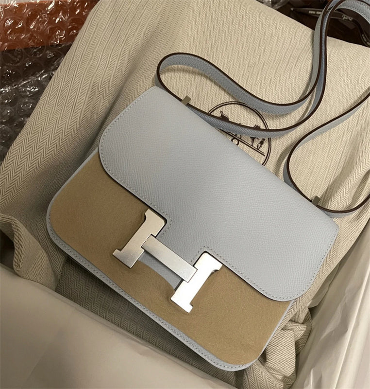  modern top-handle bag styled with outfit