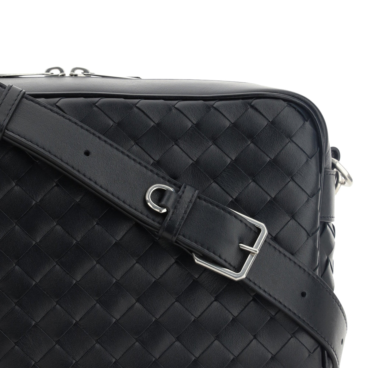 Close-up of Bottega Veneta cross body bags hardware and fine stitching