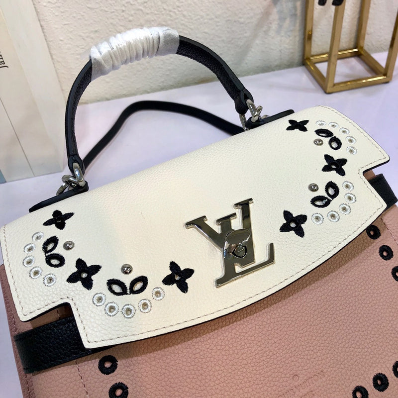 Back view of structured signature women's handbag – women's statement bag