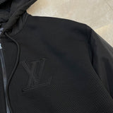 Full styled look of Louis Vuitton luxury clothing with label-forward styling