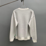 Side profile of Louis Vuitton luxury clothing with logo-detail design