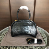Top view of modern chic women's handbag – women's designer-style accessory