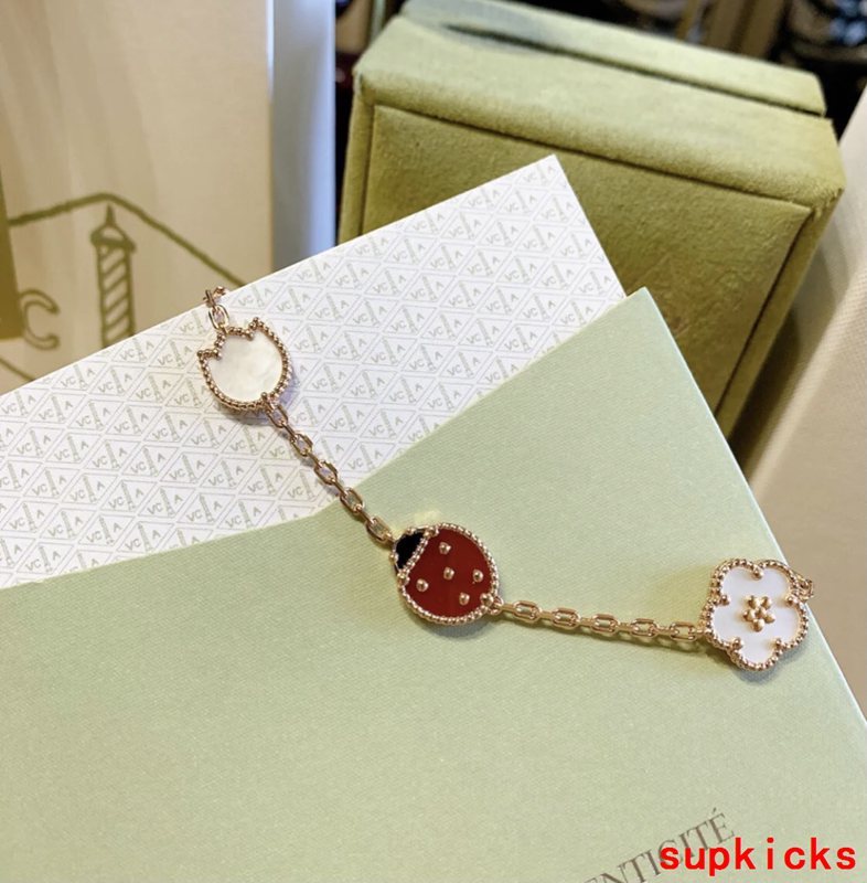 Lifestyle view of Van Cleef & Arpels unisex jewelry piece