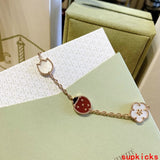 Lifestyle view of Van Cleef & Arpels unisex jewelry piece