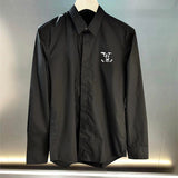 Flat lay presentation of Louis Vuitton luxury clothing with tailored silhouette
