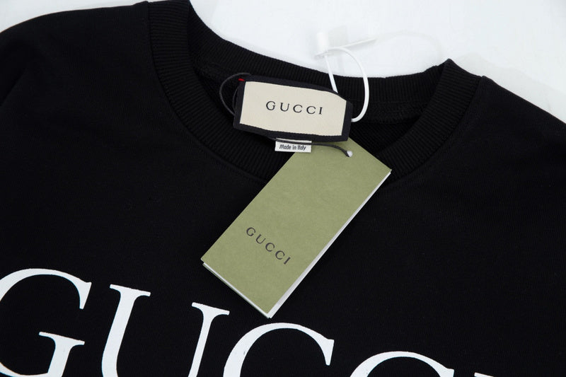 Flat lay presentation of Gucci luxury clothing with everyday silhouette