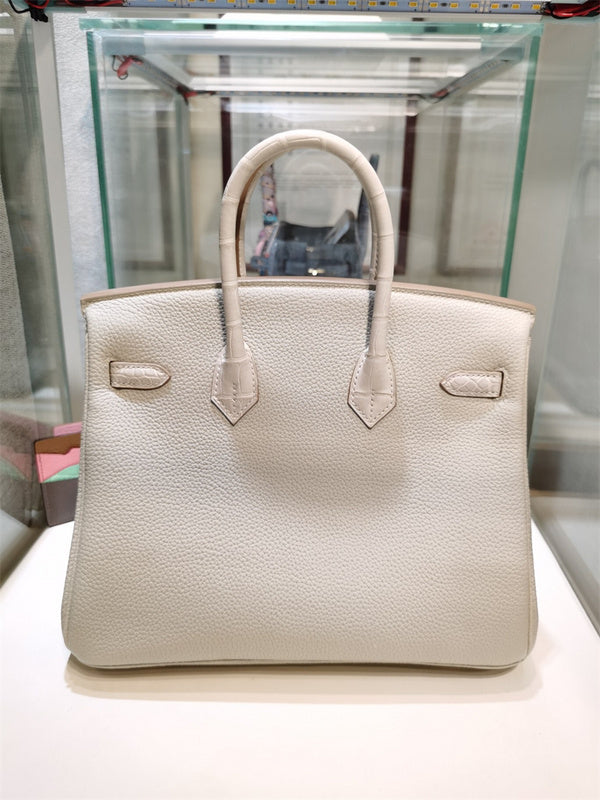 Side view of considered structured handbag