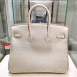 Side view of considered structured handbag