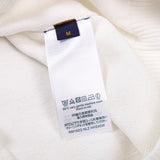 Full styled look of Louis Vuitton luxury clothing with label-forward styling