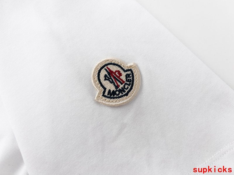 Front view of Moncler luxury clothing with logo-detail design