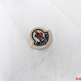 Front view of Moncler luxury clothing with logo-detail design