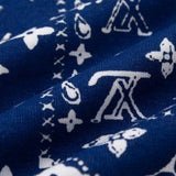 Flat lay presentation of Louis Vuitton luxury clothing with signature branding