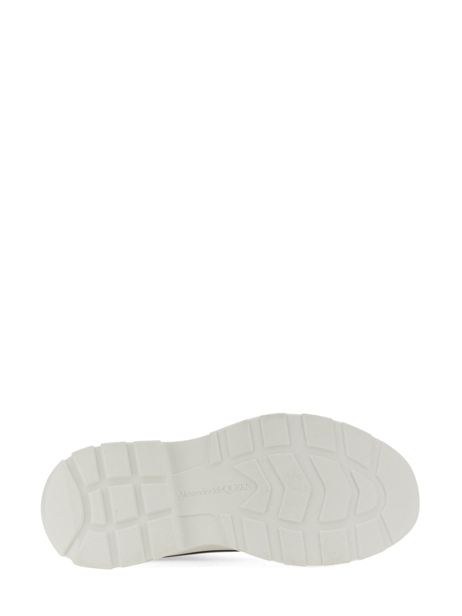 Close-up of Alexander McQueen athletic hardware and fine stitching
