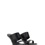 Close-up of Alexander McQueen sandals hardware and fine stitching