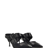 Close-up of Alexander McQueen sandals hardware and fine stitching
