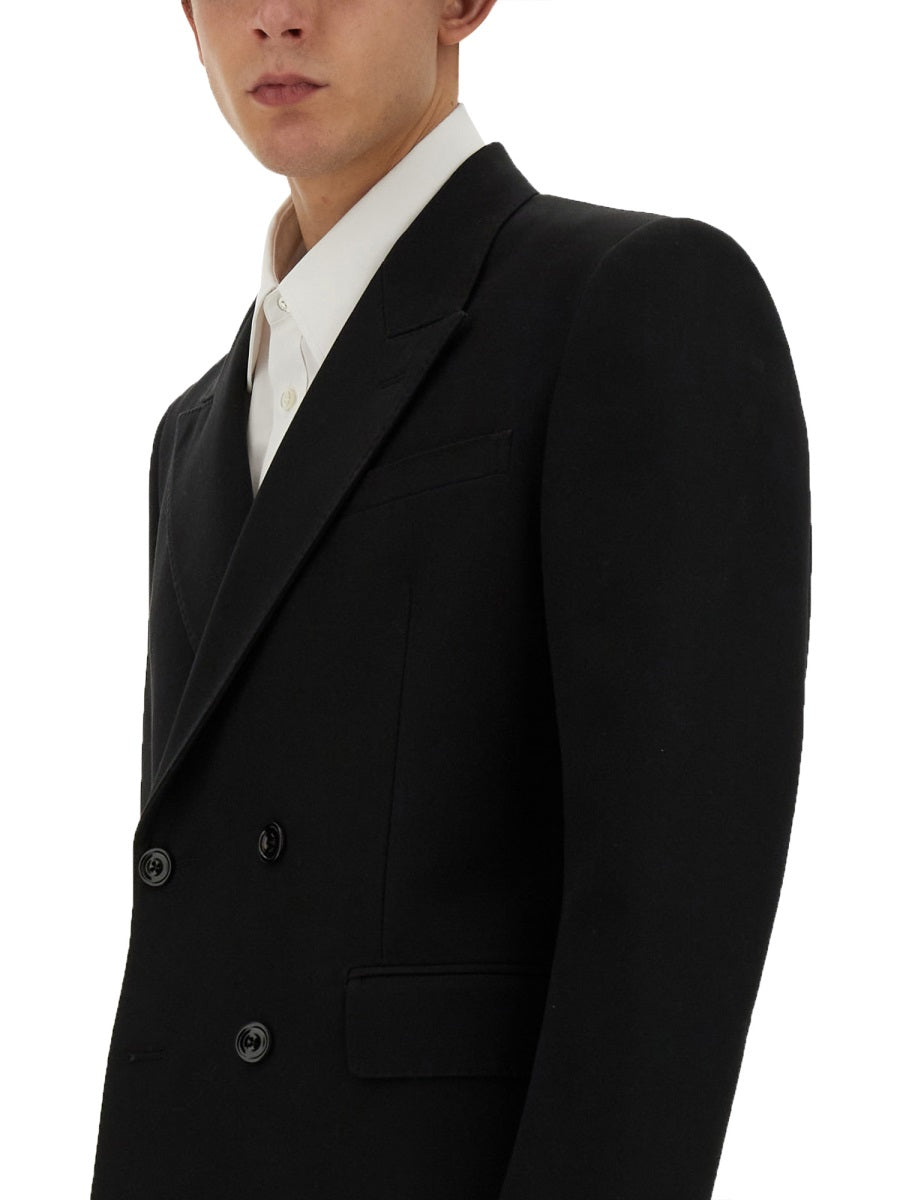 Close-up of Alexander McQueen jackets hardware and fine stitching