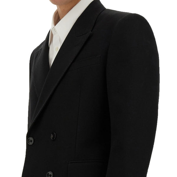 Close-up of Alexander McQueen jackets hardware and fine stitching
