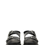 Close-up of Alexander McQueen sandals hardware and fine stitching