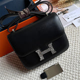 Side view of streamlined structured handbag