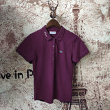 Front view of Lacoste luxury clothing with signature branding