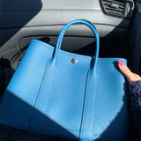  Minimalist shoulder bag carried on shoulder
