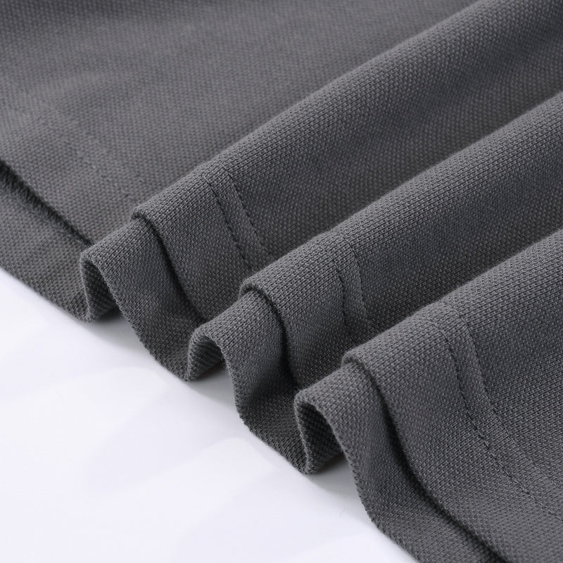 Close-up detail shot of Polo cotton polo shirt with monogram-inspired silhouette