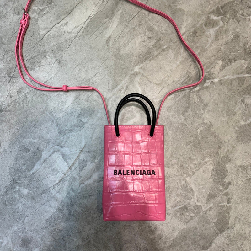 Bold Faux Leather Handbag - Signature Hardware Accents | Women's Fashion Handbag #985 - side angle view (image 2) of designer-inspired handbag